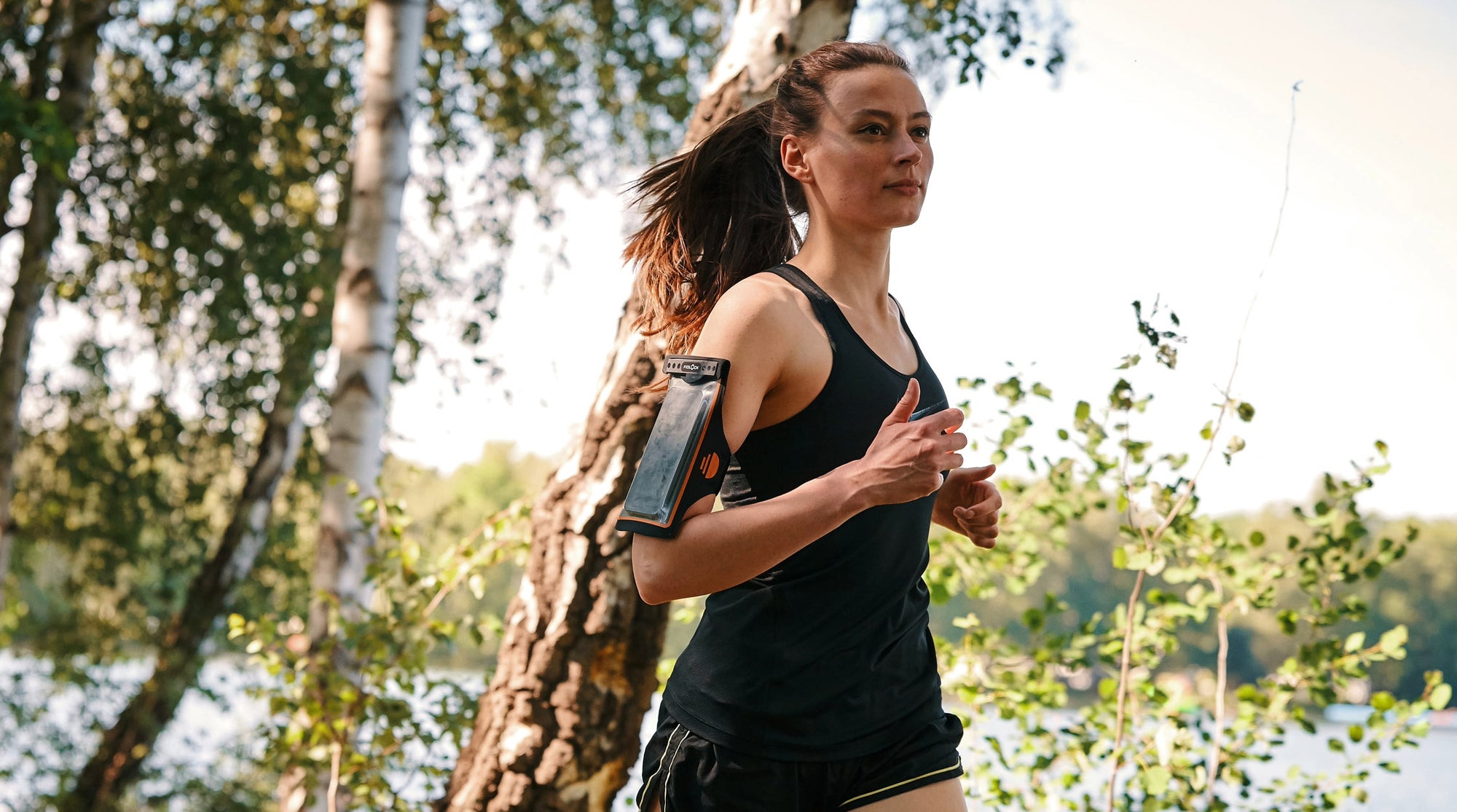 Fidlock Hermetic Arm Band Dry Bag Worn By Female Jogger