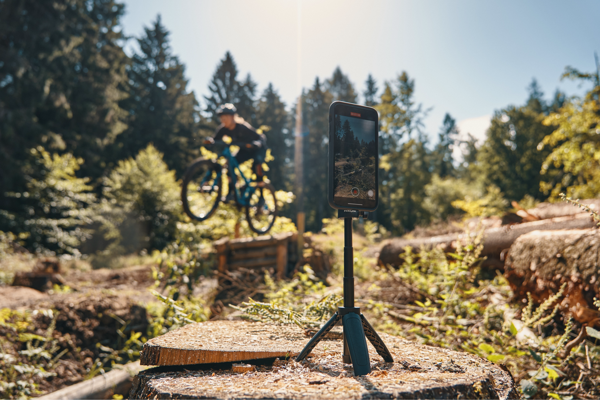 Fidlock VACUUM phone mounting system used with a tripod by a content creator